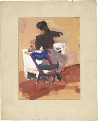 [Woman seated at table]