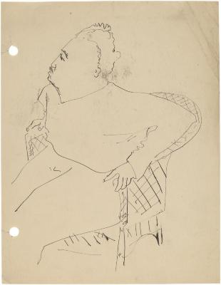 [Man in wicker chair]