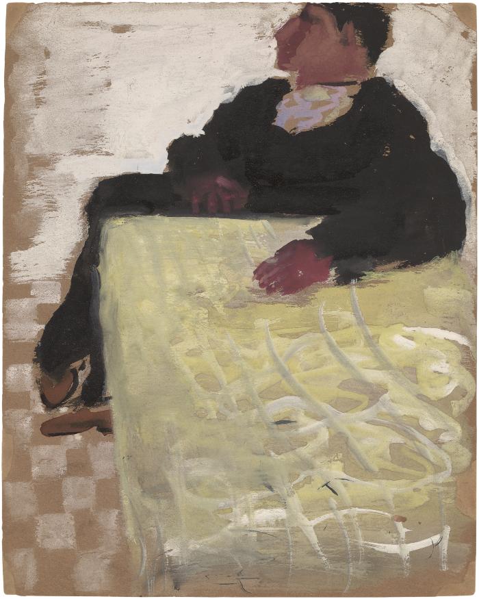 [Man seated at table]