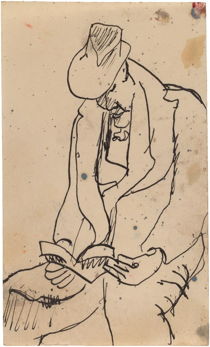 [Seated man reading]